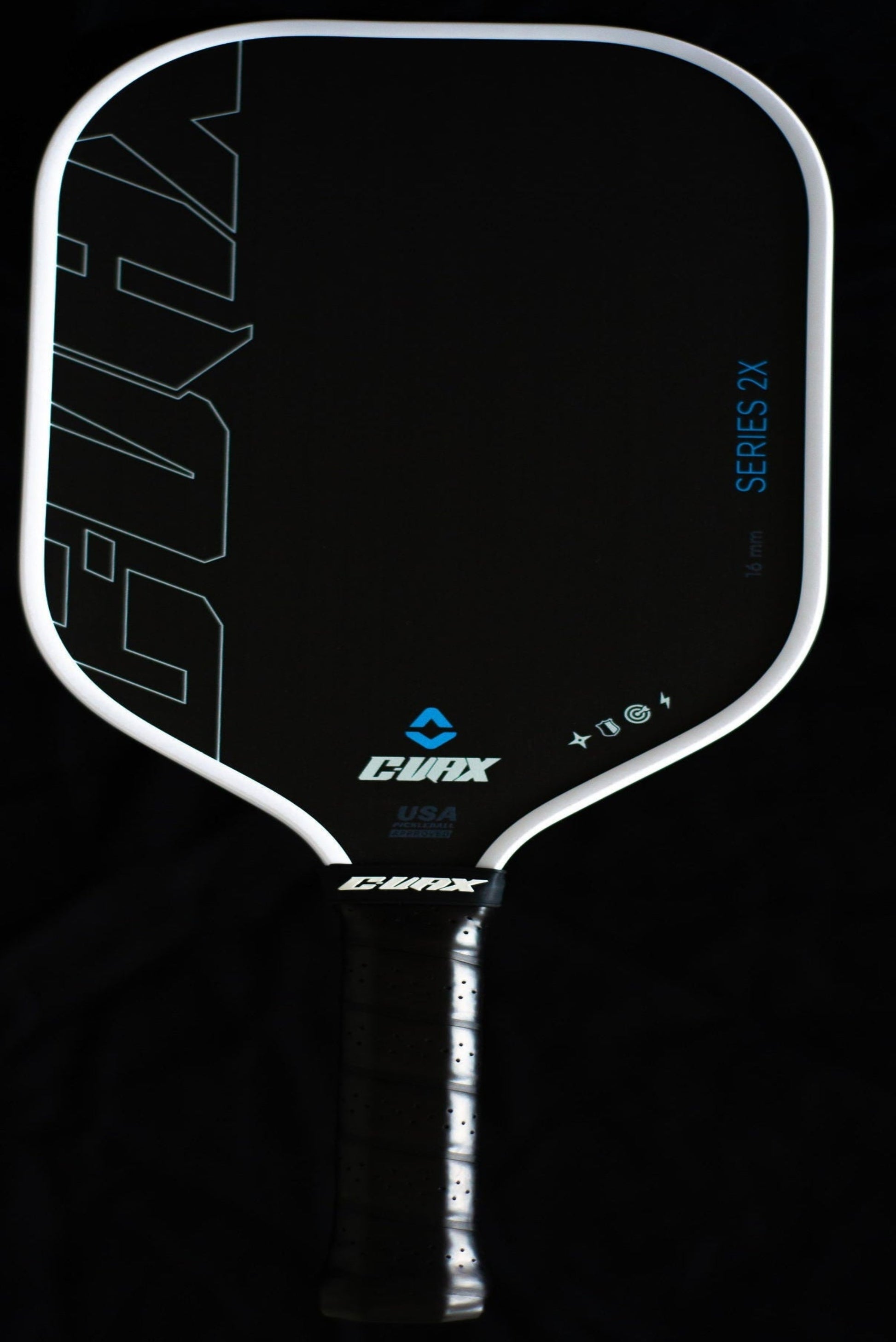 Pickleball paddle with 'Evolva' branding on a black background